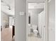 Functional pass-through bathroom with tiled floors, featuring all white fixtures and accents at 3605 60Th W St, Bradenton, FL 34209