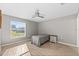 Simple bedroom with a ceiling fan and bright natural light at 3605 60Th W St, Bradenton, FL 34209