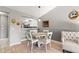 Cozy dining area with a round table, chair set, and modern lighting fixtures at 3605 60Th W St, Bradenton, FL 34209