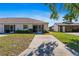 Inviting single-story home with a well-maintained lawn and covered front patio at 3605 60Th W St, Bradenton, FL 34209