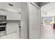 Bright kitchen with stainless steel appliances and white cabinetry at 3605 60Th W St, Bradenton, FL 34209