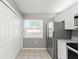 Bright kitchen with stainless steel appliances, white cabinets, and a view to the exterior at 3605 60Th W St, Bradenton, FL 34209
