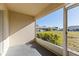 Enclosed lanai featuring a view of the community landscaping at 3605 60Th W St, Bradenton, FL 34209