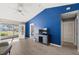 Bright living room with blue accent wall and access to a screened outdoor area at 3605 60Th W St, Bradenton, FL 34209