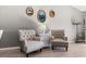 Charming seating arrangement with two accent chairs and a decorative table at 3605 60Th W St, Bradenton, FL 34209
