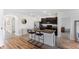 Modern kitchen island with granite countertops, seating, and black appliances at 362 Tierra Verde Way, Bradenton, FL 34212