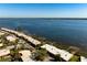Stunning aerial view of waterfront condos with breathtaking water views on a sunny day at 3875 Catalina Dr, Bradenton, FL 34210