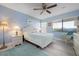 Bedroom features light blue walls and a ceiling fan at 3875 Catalina Dr, Bradenton, FL 34210