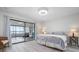 Bedroom with sliding glass doors leading to enclosed sunroom at 3875 Catalina Dr, Bradenton, FL 34210