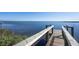 Scenic view of the dock with clear blue water and distant city skyline in the background at 3875 Catalina Dr, Bradenton, FL 34210