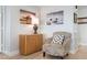 Welcoming hallway featuring a cozy chair and tasteful decor at 3875 Catalina Dr, Bradenton, FL 34210
