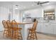 Modern kitchen featuring a breakfast bar and white cabinets at 3875 Catalina Dr, Bradenton, FL 34210