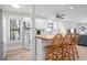 Bright kitchen features white cabinetry, a butcher block island, and stainless steel appliances at 3875 Catalina Dr, Bradenton, FL 34210