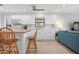 Bright kitchen with white cabinets and a modern breakfast bar area at 3875 Catalina Dr, Bradenton, FL 34210