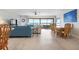 Bright and airy living room with stunning waterfront views and stylish furnishings, including a dining area at 3875 Catalina Dr, Bradenton, FL 34210