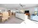 Open-concept living and dining area with light-colored floors and bright, modern furnishings at 3875 Catalina Dr, Bradenton, FL 34210