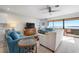 Bright and airy living room with comfortable seating, stylish furnishings, and stunning water views at 3875 Catalina Dr, Bradenton, FL 34210