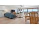 Bright and airy living room with stunning waterfront views and stylish furnishings, including a dining area at 3875 Catalina Dr, Bradenton, FL 34210