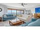 Bright living room with water view and open floor plan to dining area at 3875 Catalina Dr, Bradenton, FL 34210