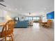 Bright and airy living room with stunning waterfront views and stylish furnishings, including a dining area at 3875 Catalina Dr, Bradenton, FL 34210