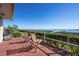 Relaxing outdoor patio with a grill and comfortable seating overlooks the beautiful waterfront at 3875 Catalina Dr, Bradenton, FL 34210