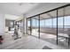 View of sunroom with floor-to-ceiling windows, tile flooring and exercise equipment at 3875 Catalina Dr, Bradenton, FL 34210