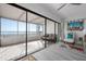 Bright sunroom with floor to ceiling glass windows and tile flooring at 3875 Catalina Dr, Bradenton, FL 34210