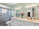 Bright bathroom with double sinks, a shower, and ample counter space at 4058 Oakhurst Dr # 3174, Sarasota, FL 34233