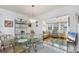 Dining room featuring a glass-top table and view to a sun-lit living room at 4058 Oakhurst Dr # 3174, Sarasota, FL 34233
