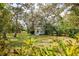Charming gazebo nestled in a serene green setting, surrounded by lush trees and greenery at 4058 Oakhurst Dr # 3174, Sarasota, FL 34233
