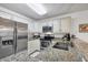 Classic kitchen with stainless steel appliances, granite countertops, and crisp white cabinetry at 4058 Oakhurst Dr # 3174, Sarasota, FL 34233