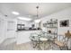 Open kitchen and dining area with stainless steel appliances and tile flooring at 4058 Oakhurst Dr # 3174, Sarasota, FL 34233