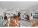 Open-concept living and dining area featuring hardwood floors and ample natural light at 4058 Oakhurst Dr # 3174, Sarasota, FL 34233