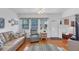 Cozy living room with hardwood floors and views of the front yard at 4058 Oakhurst Dr # 3174, Sarasota, FL 34233