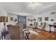 Spacious living room featuring hardwood floors, a ceiling fan, and traditional furniture at 4058 Oakhurst Dr # 3174, Sarasota, FL 34233