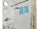 Clean, modern bathroom featuring a shower with rainfall showerhead, tiled walls, and stylish vanity at 436 Parkview Dr, Sarasota, FL 34243