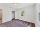 Clean bedroom with carpet, featuring a closet and natural light through its window, maximizing space and comfort at 436 Parkview Dr, Sarasota, FL 34243
