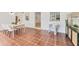 Dining area boasting terracotta tile floors, an adjacent room with a buffet and a view of an adjacent living space at 436 Parkview Dr, Sarasota, FL 34243