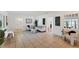Open-concept living room featuring neutral colors, tile floors and a modern design at 436 Parkview Dr, Sarasota, FL 34243