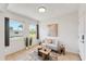 Cozy living room with tile flooring, comfortable seating, and large windows providing natural light and views at 436 Parkview Dr, Sarasota, FL 34243
