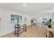 Spacious living room filled with natural light, tile floors, and simple, modern decor at 436 Parkview Dr, Sarasota, FL 34243