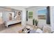 Stylish bedroom open to a living space with tile floors, natural light, and comfortable furniture, creating an inviting ambiance at 436 Parkview Dr, Sarasota, FL 34243