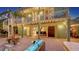 Backyard with outdoor seating, spiral staircase, and a view into the dining area through sliding glass doors at 4941 Commonwealth Dr, Sarasota, FL 34242