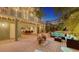 Relaxing backyard with a patio, outdoor furniture, lush greenery, and a glimpse of the home's interior at 4941 Commonwealth Dr, Sarasota, FL 34242