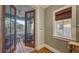 Balcony access with french doors leading into the main bedroom and a view of the ocean at 4941 Commonwealth Dr, Sarasota, FL 34242