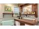 Home bar featuring ample storage, custom shelving, and a built-in wine cooler for entertaining guests at 4941 Commonwealth Dr, Sarasota, FL 34242