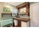 Charming home bar with custom woodwork, ample storage, and decorative accents for entertaining at 4941 Commonwealth Dr, Sarasota, FL 34242