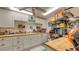 Organized basement workshop with ample storage, workbench, and well-lit workspace at 4941 Commonwealth Dr, Sarasota, FL 34242