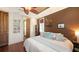 Comfortable bedroom showcasing hardwood floors, natural light, and charming decor at 4941 Commonwealth Dr, Sarasota, FL 34242