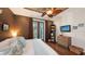 Spacious bedroom with hardwood floors, custom ceiling fan, and natural light at 4941 Commonwealth Dr, Sarasota, FL 34242